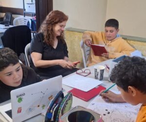 Valeria Bustamante-helping students with their homework in Montevideo, Uruguay.