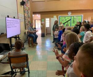 Heather leading the song "Love the Lord Your God" for Titchie chapel