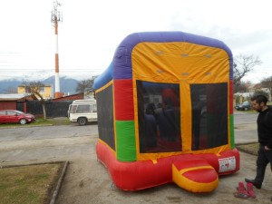 A bounce house attracts children from the neighborhood!